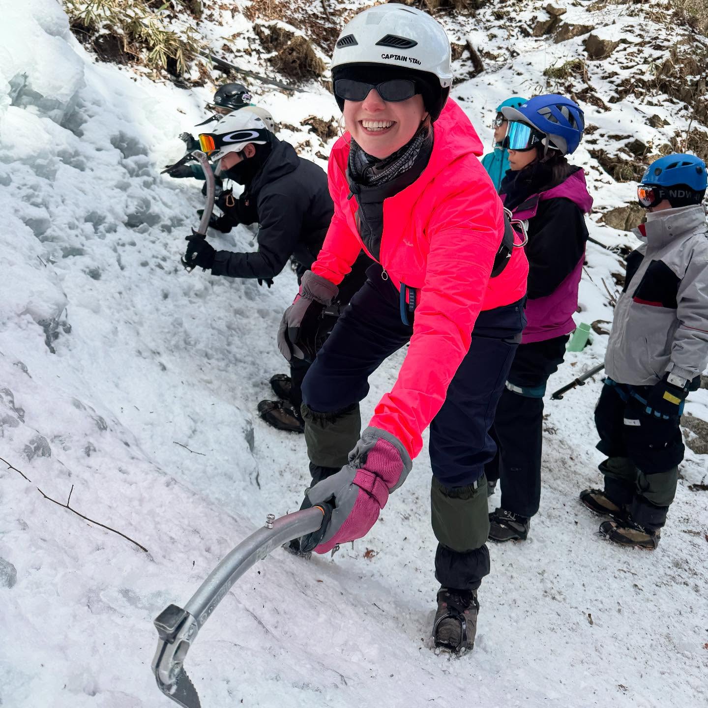Smiles and first swings on the ice wall.